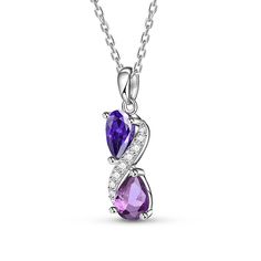 Step into a world of enchantment with this stunning necklace, adorned with two lustrous pear-cut purple stones, each exuding its unique shade and allure. Nestled between them, a radiant swirl of glistening white stones adds a touch of celestial brilliance, creating a harmonious dance of colors and light. Embrace the beauty of contrast and sophistication, let this exquisite piece be a symbol of your elegance and charm, a timeless treasure that captures the essence of grace and luxury.Carat Weight Elegant Purple Clavicle Chain Necklace, Purple Drop Necklace For Formal Occasions, Purple Necklaces With Sparkling Stones For Gift, Elegant Purple Pear Shaped Jewelry, Formal Purple Drop Necklace, Purple Necklace With Sparkling Stones For Gift, Elegant Lavender Drop Necklaces, Purple Teardrop Necklace For Formal Events, Purple Teardrop Necklace For Formal Occasions