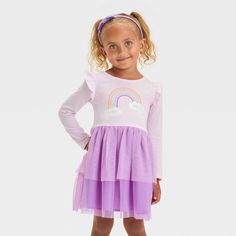 Add a touch of whimsical charm to your toddler's looks with the Long-Sleeve Rainbow Tulle Dress from Cat & Jack™. This long-sleeve dress features a rainbow at the front along with ruffles on the shoulders and a mesh overlay below the waist for a sweet look. Tailored from a soft fabric blend, this knee-length dress offers comfort through their whole day. Cat & Jack™: Designed for all children so you can trust it's made for yours. Playful Long Sleeve Dresses For Fall, Cute Long Sleeve Twirl Dress For Fall, Playful Long Sleeve Dress For Dress-up, Playful Long Sleeve Dress-up Dresses, Playful Long Sleeve Dress For Spring, Spring Long Sleeve Playful Dress, Spring Long Sleeve Dresses For Playtime, Long Sleeve Dresses For Playtime In Spring, Long Sleeve Dresses For Spring Playtime