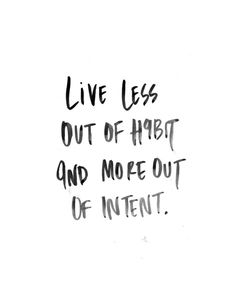 the words live less out of habit and more out of intent written in black ink