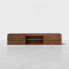 the sideboard is made out of wood and has two drawers on each side, one with