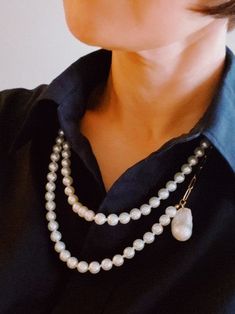 Elevate your style with Pearls Your Way Long Chain Necklace. Adorned with a genuine freshwater baroque pearl pendant, this versatile accessory brings a touch of luxury to any outfit. Wear it long or wrap it for a chic and elegant look. Color: Pearl Made of: 18k gold plated stainless steel with tarnish and water-resistant, Glass pearl beads, Lead and Nichol-free Brand: Ellison and Young Includes: x1 Chain, x1 Genuine Baroque Pearl Pendant Size: Approximately 34" long, no opening Baroque Pearl Pendant, Chic And Elegant, Long Chain Necklace, Long Chain, Baroque Pearls, Pearl Pendant, Pearl Beads, Fresh Water, Chain Necklace