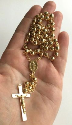 "18k gold over 925 sterling silver italian rosary 24\" long . for protection and good luck made in italy 6 mm beads gr:34.4 rosario de 925 plata esterlina con 18k bano de oro 24\" largo . para proteccion y buena suerte . hecho en italia 6 mm beads gr: 34.4" Elegant Gold Rosary As Gift, Elegant Gold Rosary For Gift, Gold Rosary Bracelet With Cross And 8mm Beads, Elegant Gold Anniversary Rosary, Elegant Gold Rosary For Anniversary, Gold Round Beads Rosary As Gift, Gold Rosary With Round Beads As Gift, Gold Spiritual Rosary Bracelet With Polished Beads, Gold Spiritual Rosary With Round Beads