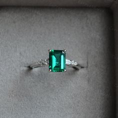 Breathtaking minimalist style green emerald ring, with a 1.2ct emerald in the middle, with a pear stone and two round stone on each side, simple but elegant design, can also wear with different bands, to make a unique match, beautiful and special gift for someone you loved or for yourself, we all worth beautiful items. ❥Details: Material: Solid 14K Gold Main Stone: 1.25ct Lab Created Emerald Cut: Emerald Side Stone: CZ/Moissanite CSG076 See other gold items in our shop: https://www.etsy.com/shop Green Emerald Jewelry For Proposal, Elegant Green Pear-shaped Rings, Green Emerald Ring With Prong Setting In Pear Shape, Green Emerald Ring With Accent Stones For May Birthstone, White Gold Emerald Promise Ring, White Gold Emerald Ring For Proposal, Green Emerald Birthstone Ring With Center Stone, Pear-shaped Green Emerald Ring With Prong Setting, Proposal White Gold Emerald Ring