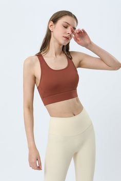 75% Nylon . 25% Spandex Soft. comfortable. skin friendly 4-way stretch. breathable and sweat-wicking Built-in Bra with Removable Pads Light. breathable mesh promotes cooling ventilation Cut-out design provides a breezy feel and stylish look Adjustable buckle designs for easy customization and comfortable wear Perfect for both sports activities and daily life Brown Compression Activewear For Workout, Brown Sleeveless Activewear For Sports, Solid Breathable Activewear With Medium Support, Brown Athleisure Activewear For Training, Sporty Brown Activewear For Training, Breathable Solid Sports Bra For Light Sports, Sporty Brown Sports Bra For Gym, Brown Sleeveless Activewear For Workout, Brown Compressive Activewear For Gym