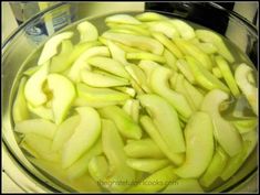 sliced apples are sitting in a bowl on the stove top, ready to be cooked