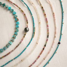 Feel the island vibes with the Endless Summer Necklace - Turqs + Caicos! This playful piece combines turquoise stones with gold fill beads and dangles, inspired by the laid-back luxury of the Turks and Caicos islands. Each piece is handmade in sunny Los Angeles, adding a touch of California cool to your look. One-of-a-kind with natural bead variations, these necklaces also come with a removable 2-inch extender, letting you style them your way. In stock necklaces will ship within 3 business days Sea Glass Crafts Jewellery, Sand Necklace, Boho Jewelry Diy, The Endless Summer, Juicy Watermelon, Ocean Inspired Jewelry, Pave Bracelet, Pearl Gifts, Pave Beads