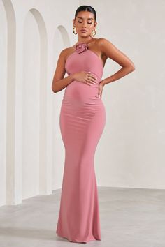 Exude a romantic state of mind in our blush pink maternity maxi Loving. Defined by a statement floral corsage. this halter-neck arrives in a smooth stretch jersey renowned for its sculpting capabilities. For the perfect baby shower ensemble. try styling Loving with a sleek bun and strappy stilettos. Features - Premium stretch jersey- Self tie halter neckline- Flower corsage- Sleeveless - Invisible zip closure - Bump ruching - Maxi length Sizing & Fit Model is 5'8.5 and wears UK size 8/ US size 4 Chic Pregnancy Style, Floral Corsage, Pink Maternity Dress, Sleek Bun, Maternity Maxi Dress, Black Dress Prom, Strappy Stilettos, Black Tie Gala, Flower Corsage