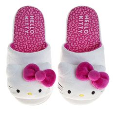 a pair of hello kitty slippers with pink bows on the front and back sides