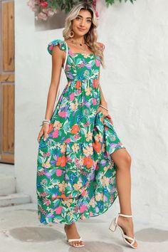 This flowy dress is perfect for warm weather or beach outings. The ruffled shoulder strap adds movement and an extra layer of visual interest. It showcases a vibrant and colorful floral pattern, creating a fresh and summery vibe The high waist design accentuates the curves and creates a feminine silhouette. Wholesale maxi dresses available for bulk orders, great for retailers Fabric Contents: Product Weight: 0.73 kgMaterial: 100%Polyester