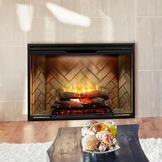 a living room with a fire place in the center and white rugs on the floor