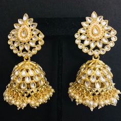 Kundan Pearl Jhumka/ Golden Kundan Jhumka/ Sabyasachi Kundan Earring/ Indian Punjabi Jhumka/ Wedding Earrings/ Bridesmaid Kundan Jhumka Features Traditional Kundan Jhumka Handcrafted To Perfection Light Weight Jewelry Perfect For Indian Weddings And Celebrations A Beautiful & Memorable Gift for Weddings and Special Occasions 22k gold plated jewelry Length: 2.85 Inches Click here to see the complete collection of Kundan and Polki Statement Earrings at AryaFashions: https://www.etsy.com/shop/AryaF Punjabi Jhumka, Kundan Jhumka, Earring Indian, Light Weight Jewelry, Golden Earrings, Earrings Bridesmaid, Kundan Earrings, Indian Weddings, Fantasy Jewelry