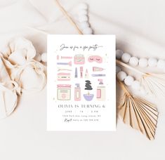 an image of a birthday party card with makeup and cosmetics items on the table next to some lollipops