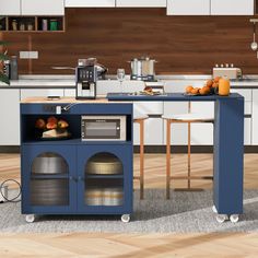 a kitchen with an island and blue cabinets