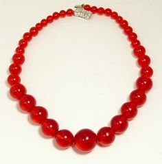 "Vintage Red Prystal Lucite Bead Necklace Rhinestone Clasp Fabulous Example Of Early Lucite, Found In The Original Gift Box Appears To Never Been Worn  Red Prystal Lucite Lucite Beads With A Rhinestone Set Box Clasp Measures 16 3/8\" Length The Largest Bead Measures 5/8\" (15.5mm)  jujubee1.etsy.com  To Browse My Shop" Vintage Red Gemstone Beads, Vintage Red 8mm Beaded Jewelry, Vintage Red Jewelry With 8mm Beads, Vintage Red Gemstone Beaded Necklaces, Red Beaded Necklaces For Parties, Vintage Red Gemstone Beads Jewelry, Red Vintage Jewelry With Gemstone Beads, Red Crystal Beaded Necklaces With Round Beads, Red Beaded Necklaces With Faceted Beads