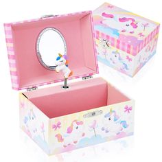 an open pink box with a unicorn figurine in it's top and bottom