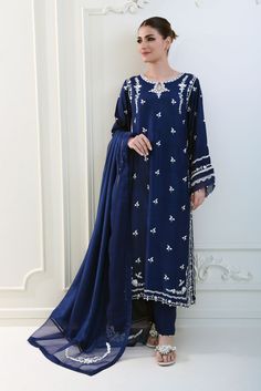 Meticulously crafted from a remarkably glamourous shade of navy blue ( pure raw silk 58 Gms )“ Tahzeeb “ with its intricate embroidered details strike the perfect balance between elegant and eye-catching, making this beautiful design a must have. The length of the long kameez is 46 inches.Order Duration: 4 to 6 weeks Indigo Wedding Sets With Dupatta, Wedding Indigo Sets With Dupatta, Indigo Wedding Set With Dupatta, Blue Silk Kurta With Zari Work, Indigo Chanderi Traditional Wear For Wedding, Silk Blue Kurta With Resham Embroidery, Silk Kurta With Resham Embroidery In Blue, Blue Silk Kurta With Resham Embroidery, Semi-stitched Indigo Wedding Sets