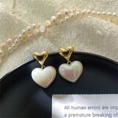 Gleaming pearls and bright 18k gold-plated metal meet in this shimmery drop earring pair featuring a classic heart motif. 0.62" W x 1.06" L 18k gold-plated copper / pearl Copper Pearl, Heart Motif, Heart Drop Earrings, Drop Earring, 18k Gold, Gold Plate, Copper, Plating, Drop Earrings