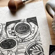 an ink drawing of two cups of coffee on top of a piece of white paper