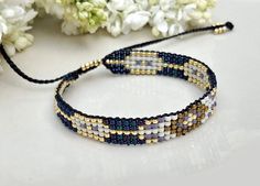 Beautiful boho bracelet made of beads with adjustable clasp. In the hippie style, it looks beautiful. Dominant color: navy blue. Width 1 cm (0,39 inch), length  15 cm ( 5,9 inch) Blue And Gold Jewelry, Bracelet Loom, Gold Schmuck, Loom Jewelry, Navy Blue And Gold, Bracelets Handmade Diy, Huichol Art, Bead Weaving Patterns, Handmade Beaded Jewelry