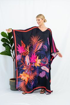 A full length kaftan plus size featured with abstract floral vibrant print  will bring the elegant vibe of forever spring and would be a perfection for holiday occasions or any event you attend. The fabric is blended silk with more than 80% silk so the care is more easier with washing and iron, in addition less wrinkles. It's totally smoothly flowy, soft and gentle touch. FEATURES - Pink, Black and Vibrant Colors - Palm and Leaf - Personal Custom Made - Full Length Kaftan Half-Sleeves - Designer Silk Kaftan - Plus Size and Custom Length - Resort Wear, Beach Wear, Lounge Wear, Pool Cover Up Kaftan - Boat Neck -------------------------------- DETAIL  * The size can be adjusted to fit up to 5 XL. Bust/ Waist/ Hip up to 53 inches ( 106 inches full circumference)  * Length of the kaftan could b Black Floral Print Kaftan For The Beach, Vibrant Multicolor Floral Print Kaftan, Black Floral Print Maxi Kaftan, Multicolor Abstract Print Kaftan For Vacation, Vacation Kaftan With Multicolor Abstract Print, Vacation Multicolor Abstract Print Kaftan, Beachwear Kaftan With Vibrant Print And Kimono Sleeves, Beach Kaftan With Kimono Sleeves And Abstract Print, Vibrant Print Kaftan For Vacation