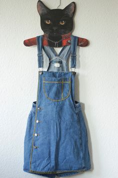 Upcycled Vintage Blue Bronze Denim Dungarees Skorts Size S, see below for measurements Brand: Dixie Blues, Authentic Original 100% cotton side button placket with breast pocket looks like a dungaree dress at first glance there are shorts under the skirt this vintage piece was painted with shimmering gold textile paint now a real eye-catcher and absolutely unique piece Vintage condition: VERY GOOD, only a small material defect on the back Waist size: approx. 33cm Length: approx. 82 cm (but can be High-waist Blue Denim Dress, Vintage Light Wash Denim Overalls, Retro Denim Bib Front Jumpsuit, Retro Denim Jumpsuit With Bib Front, Vintage Denim Blue Denim Dress With Pockets, Denim Blue Retro Overalls, Retro Denim Blue Overalls, Medium Wash Overalls With Buttons, Medium Wash Buttoned Overalls