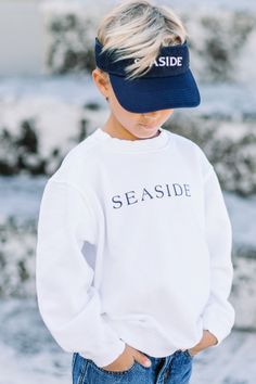 100% Preshrunk Cotton Garment Dyed Sweatshirt. Seaside logo screen printed on the front. Tagline, "New Town, Old Ways" graphic across the back. SIZING: XXS {size 18 mo to 2T} XS {size 3/4} S {size 5 to 6/8} M {size 8/10} L {size 10/12} Seaside Sweatshirt, Old Ways, Seaside Style, Loose Pigments, Dyed Sweatshirt, Vinyl Shirts, New Town, Navy Women, New Wardrobe