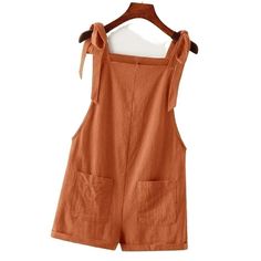 Adorable Tie Knot Strap Overall Shorts Pocket Jumpsuit In Rust Brown Fabric: 100% Cotton Design: Tie Knot Strap/ Double Pocket Front/ Roll Up Hem Small: Size 4 Length:31.1 Inch, Bust:35 Inch, Waist Size:35.8 Inch, Hip Size:4 0.9 Inch, Thigh:27.2 Inch, Straps Length:25.6 Inch Medium: Size 6 Length:31.6 Inch, Bust:36.6 Inch, Waist Size:37.4 Inch, Hip Siz E:42.5 Inch, Thigh:28 Inch, Straps Length:25.8 Inch Large: Size 8/10 Length:32.3 Inch, Bust:39 Inch, Waist Size:39.8 Inch, Hip Size:4 4.9 Inch, T Cotton Jumpsuits And Rompers With Tie Straps For Vacation, Cotton Jumpsuit With Tie Straps For Vacation, Summer Cotton Overalls For Day Out, Sleeveless Summer Shortalls With Pockets, Overalls With Pockets For Day Out, Summer Overalls With Pockets For A Day Out, Summer Overalls With Pockets, Solid Overalls With Pockets For Day Out, Casual Solid Overalls For Summer