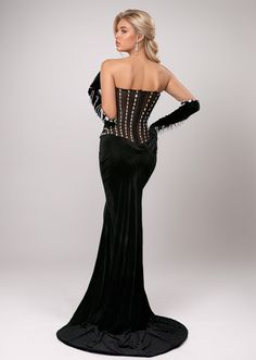 Elevate your gala attire with our Gertrude dress. Featuring a stunning black design, this floor length dress boasts an elegant strapless neckline and a front high split for a touch of allure. The rhinestone embroidery adds a touch of glamour while the included gloves complete the look. Perfect for any formal event. Fabric: Slight Stretch Material: Polyester Fiber Evening Strapless Dress With Fitted Bodice, Black Corset Dress For Prom Evening, Glamorous Black Dress With Corset Back, Black Corset Dress With Sweetheart Neckline For Evening, Gala Evening Dress With Boned Bodice, Strapless Gown With Corset Back For Evening, Boned Bodice Overbust Evening Dress For Gala, Black Floor-length Corset Dress For Prom Season, Black Overbust Dress For Prom