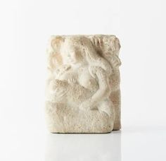 a white sculpture sitting on top of a table