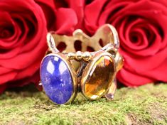 "This stunning piece of art is one of a kind, and there is no other ring exactly like it. It was made by a process called lost wax casting, where a piece of wax is carved and then a mold is made from it. The mold is only used once. Set in the ring is a beautiful deep blue Sapphire cabochon and faceted Citrie. Alongside are polished crystals including amethyst and citrine. The ring is made of sterling silver which has been oxidized or \"antiqued\". The accents are 24K gold vermeil. The plating is Yellow Gold Citrine Gemstones With Multi-stone Detail, Silver Citrine Multi-stone Rings, Hallmarked Citrine Jewelry In Orange, Victorian Hallmarked Citrine Jewelry, Silver Multi-stone Citrine Rings, Polished Crystals, Cast Rings, Amethyst And Citrine, Sapphire Cabochon