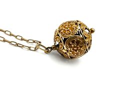 "Unusual 21-inch antique necklace: a 10k pierced ornate filigree globe pendant on an antique 8ct chain. The jump link was added later but it's antique and marked 14k. The vintage gold-filled clasp is a replacement. Measurements: 5/8\" wide x 1 1/16\" high Weight: 5.41g NEC.INS_0004.23 FREE DOMESTIC STANDARD SHIPPING Another Sky Vintage Home Page https://www.etsy.com/shop/AnotherSkyVintageLLC?ref=hdr_shop_menu PA residents will have 6% sales tax added where applicable. Other states charge taxes on online purchases as well. Buyers will find these are added to the bill automatically by Etsy, wherever they apply. INTERNATIONAL SHIPPING: Dear international buyer, please be aware of Customs laws and duties and import taxes in your country so as to be prepared for Customs charges where they apply Ornate Vintage Charm Round Pendant Jewelry, Collectible Yellow Gold Filigree Necklaces, Heirloom Yellow Gold Jewelry With Antique Finish, Bronze Intricate Pendant Jewelry, Bronze Pendant Jewelry With Intricate Design, Yellow Gold Filigree Necklaces, Bronze Pendant With Intricate Design, Ornate Vintage Charm Pendant Jewelry, Ornate Pendant Jewelry With Vintage Charm