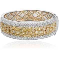 Behold the artistry of the Two Tone Diamond Cluster Bangle from the renowned house of Roman & Jules, a masterpiece that marries the timeless allure of 18K white and yellow gold with the mesmerizing brilliance of diamonds. This exquisite bangle is a symphony of contrasting hues and scintillating gemstones.At its heart lies a captivating cluster of light yellow diamonds, an awe-inspiring ensemble that boasts a total carat weight of 13.50 carats. These radiant gemstones exude warmth and elegance, m 18k Gold Bangle, Yellow Diamonds, Yellow Jewelry, Luxury Bracelet, Diamond Birthstone, Diamond Settings, Yellow Diamond, Diamond Cluster, Metal Bracelets