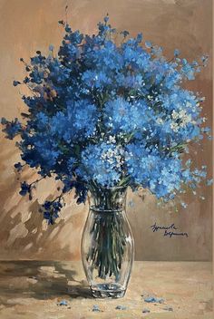 a painting of blue flowers in a glass vase on a brown tablecloth with a tan background