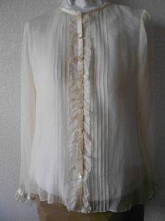 "Beautiful 100% sheer silk blouse Long sleeve Ruffled front and sleeves Expressive six front lines on both sides Satin accentuated along neckline, center and sleeve ends Great condition with no stains or rips Dimensions Shoulder 15\" Bust 39\" Sleeve 24\" Length 24\"" Classic Sheer Blouse For Work, Sheer Long Sleeve Blouse For Work, Classic Sheer Evening Blouse, Elegant Sheer Blouse For Spring, Formal Sheer Long Sleeve Blouse, Formal Long Sleeve Sheer Blouse, Elegant Sheer Blouse For Party, Classic Sheer Blouse For Office, Classic Sheer Top For Office