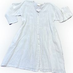 Coastal Casual 100% Linen Empire Style Dress. Fitted Bodice With Fullness Thru The Hip Area. Perfect For Summer Weather! 3/4” Sleeves,Button Front With Onseam Pockets. Soft White Color. Pit To Pit 24” Across Front Hip Measures 34” Shoulder To Hem 39” Tags On Never Worn. 3/4 Sleeve Beach Dress With Buttons, Beach Dresses With 3/4 Sleeves And Buttons, Beach Dresses With Buttons And 3/4 Sleeves, Classic Long Sleeve Summer Dresses, Casual White Dress With 3/4 Sleeves, White Linen Long Sleeve Dress, Classic Long Sleeve Linen Dress, White Flowy Buttoned Dress, White Flowy Dress With Buttons