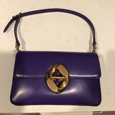 Brand New, Tags Still Attached, Stuffing Is Still In There. Not My Style - Was Given As A Gift. I've Included A Picture From The Website. Purple Purse With Big Gold Clasp To Open It. Designer Shoulder Bag With Fold Over Clasp, Purple Top Handle Shoulder Bag For Office, Chic Purple Shoulder Bag For Office, Purple Office Crossbody Shoulder Bag, Chic Purple Office Shoulder Bag, Modern Purple Bag For Formal Occasions, Purple Top Handle Bag For Formal Occasions, Classic Purple Formal Shoulder Bag, Classic Formal Purple Shoulder Bag