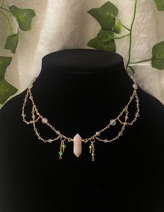 This choker is a unique, one-of-a-kind creation made with love and care! This one of a kind layered choker is inspired by the idea of a "fairy garden" with the colors of a garden in mind: pink and purple flowers, green leaves, and clear, shiny dew. This choker is made with a hand-wrapped genuine agate crystal pendant and a variety of crystal beads and glass beads. Please keep in mind that not all of the beads are crystals, as some are glass. All details on the choker are listed below. *Please lo Handmade Fairycore Festival Necklaces, Handmade Fairycore Necklaces For Festivals, Fairycore Adjustable Beaded Necklaces, Adjustable Beaded Fairycore Necklace, Handmade Fairycore Necklaces With Round Beads, Handmade Fairycore Necklace With Round Beads, Mystical Handmade Adjustable Beaded Necklace, Handmade Adjustable Mystical Beaded Necklaces, Handmade Adjustable Mystical Beaded Necklace