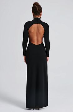 Say hello to Imelda. your new fave black dress to wear everywhere. This super sexy. versatile maxi is cut with sleek long sleeves. high neck and eye-catching low open back. It's finished with a thigh high split and boning for added structure. Style yours with black mule heels and a chic hair up.   Colour: Black. Premium stretch crepe fabric. Fully lined. High neck with buttons on back neck. Long fitted sleeves. Boning on side for added structure. Moulds to figure with bodycon fit. Thigh high split. Low open back. Maxi length. Model is an XS and is wearing an XS. Long Sleeve Dress Open Back, Long Sleek Dress, Low Cut Backless Dress, Backless Dress Long Sleeve, Black High Neck Dress, Black Dress With Open Back, Bare Back Dress, High Neck Black Dress, Homecoming Dresses Corset