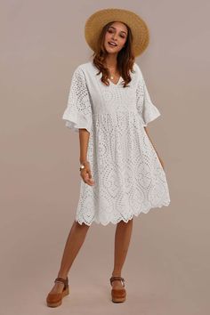 Casual Summer Dresses With 3/4 Sleeves, Casual Flowy Midi Dress With Half Sleeves, Casual Midi Dress With 3/4 Sleeves For Summer, White Half Sleeve Beach Dress, White Half Sleeve Dress For Beach, Summer Midi Dress With Half Sleeves For Daywear, Casual Midi Dress With 3/4 Sleeves For Day Out, Summer Half Sleeve Midi Dress For Daywear, White Half Sleeve Dress For The Beach