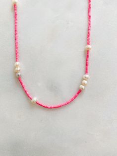 Handmade Pink Pearl Beaded Necklaces, Trendy Pearl Beaded Necklaces With Tiny Beads, Trendy Pearl Beaded Necklace With Tiny Beads, Adjustable Pink Pearl Necklace With Charm, Adjustable Pink Pearl Chain Necklace, Pink Pearl Beaded Necklace With Pearl Charm, Pink Pearl Necklace With Colorful Beads As A Gift, Handmade Pink Necklaces For Everyday Wear, Adjustable Pink Pearl Chain Jewelry