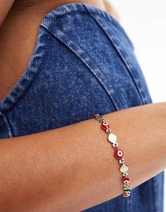 ASOS DESIGN bracelet with red eye bead detail in gold tone | ASOS Gift Makeup, Design Bracelet, Festival Accessories, Red Eye, Winter Party Dress, Neck Chain, Skirt Co Ord, Black Wrap Dress, Sunglasses Shop