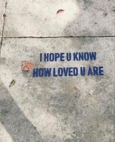 a sign on the sidewalk that says, i hope u know how loved u are