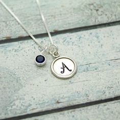 September Birthstone Initial Necklace Sapphire Jewelry | Etsy Sterling Silver Birthstone Necklace For Birthday, Silver May Birthstone Necklace For Birthday, Silver Birthstone Necklace For May Birthdays, Silver Birthstone Necklace For Birthday With Round Pendant, Classic Jewelry For Birthday Gift, Silver Charm Necklace For May Birthstone Birthday Gift, Nickel-free Silver Birthstone Necklace For Birthday, Silver Birthstone Necklace For Everyday And Mother's Day, Silver Round Birthstone Necklace For Birthday Gift