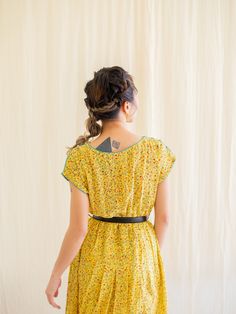 Introducing our beautiful ditsy colorful floral print vintage dress. This yellow color base dress is perfect for any occasion and is sure to turn heads. Made from soft and lightweight chiffon fabric, this dress is designed to keep you comfortable all day long. The sleeveless style and piping design neckline add a touch of elegance to the dress. This dress is perfect for those who are looking for sustainable fashion options. As a pre-loved piece, it is not only environmentally friendly but also t Yellow Sundress With Ditsy Floral Print, Yellow Ditsy Floral Print Sundress, Yellow Ditsy Floral Sundress, Bohemian Ditsy Floral Print Daywear Dresses, Bohemian Ditsy Floral Print Dress For Daywear, Vintage Yellow Floral Print Dress, Bohemian Ditsy Floral Print Day Dress, Yellow Ditsy Floral Print Beach Dress, Yellow Ditsy Floral Beach Dress