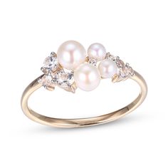 This ring is a lovely way to add sophistication to your look. Crafted in 10K yellow gold with white rhodium details, the design features a quartet of lustrous round freshwater cultured pearls. Varied sizes of round-cut white lab-created sapphires add sparkle here and there to complete the design. Pearl Wedding Ring Set, Gold Layered Bracelets, Pearl Wedding Ring, Neil Lane Engagement Rings, Pearl Diamond Jewelry, Cross Jewelry Necklace, Fan Jewelry, Pearl Engagement Ring, White Lab