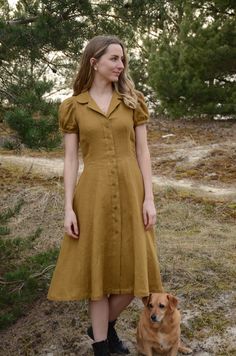 Introducing our beautiful linen midi dress - a timeless blend of classic charm and modern elegance. Crafted from 100% natural linen, this dress offers comfort and style for any occasion. With a charming collar and puffy sleeves, it adds a graceful touch to your look. It's perfect for warm days or outdoor gatherings. And the best part? Thoughtfully placed hidden pockets that seamlessly combine practicality and style. Note: Each dress is carefully handmade with attention to detail, ensuring the hi Summer Knee-length Shirt Dress With Button Cuffs, Summer Dresses With Fitted Bodice And Buttons, Solid Color Fitted Knee-length Vintage Dress, Fitted Linen Cottagecore Dress, Fitted Cottagecore Linen Dress, Cottagecore Fitted Linen Dress For Summer, Fitted Prairie Dress With Gathered Sleeves, Fitted Midi Dress With Buttons For Garden Party, Fitted Linen Collared Midi Dress