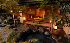 a japanese style house lit up at night