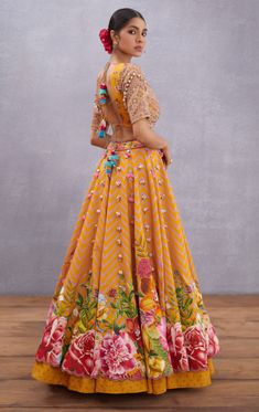 Editor's Note Featuring Yellow Sunehra Aoruni Lehenga Set Color: Topaz Yellow Fabric: Thin Handwoven Chanderi, Pure Cotton Silk Component: Lehenga, blouse and dupatta Occasion: Haldi mehndi Care: Dry Clean Only About the Designer Torani by Karan Torani stands handcrafted luxury inspired by the myriad tales of Indian mythology. Torani is a potpourri of all things nostalgic that binds you with a memory long forgotten. The label works with and revives timeless Indian textiles and embroidery traditi Torani Lehenga, Torani Designer, Indian Mythology, Haldi Outfits, Navratri Dress, Indian Outfits Lehenga, Topaz Yellow, Indian Bride Outfits, Traditional Indian Dress