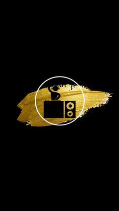 a black background with gold paint and an image of a camera