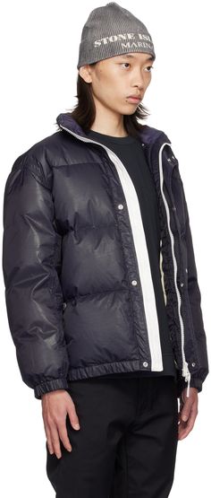 RDS-certified down-filled quilted nylon ripstop puffer jacket. Water-resistant and wind-resistant. · Stand collar · Two-way zip closure with press-stud placket · Logo printed at front and back · Welt pockets · Elasticized hem and cuffs · Adjustable press-stud fastening at side seams · Patch pocket at interior · Full taffeta lining · Logo-engraved silver-tone hardware Supplier color: Ink Supplier code: 8115446X1 Fill: 80% duck down, 20% duck feather. Sporty Down Puffer Outerwear, Sporty Down Outerwear With Padded Collar, Down Puffer Jacket With Padded Collar For Streetwear, Quilted Nylon Puffer Jacket For Streetwear, Streetwear Down Puffer Jacket With Padded Collar, Streetwear Quilted Nylon Puffer Jacket, Streetwear Quilted Nylon Jacket With Padded Collar, Sporty Down Puffer Jacket With Zipper, Sporty Down Puffer Jacket With Zipper Closure